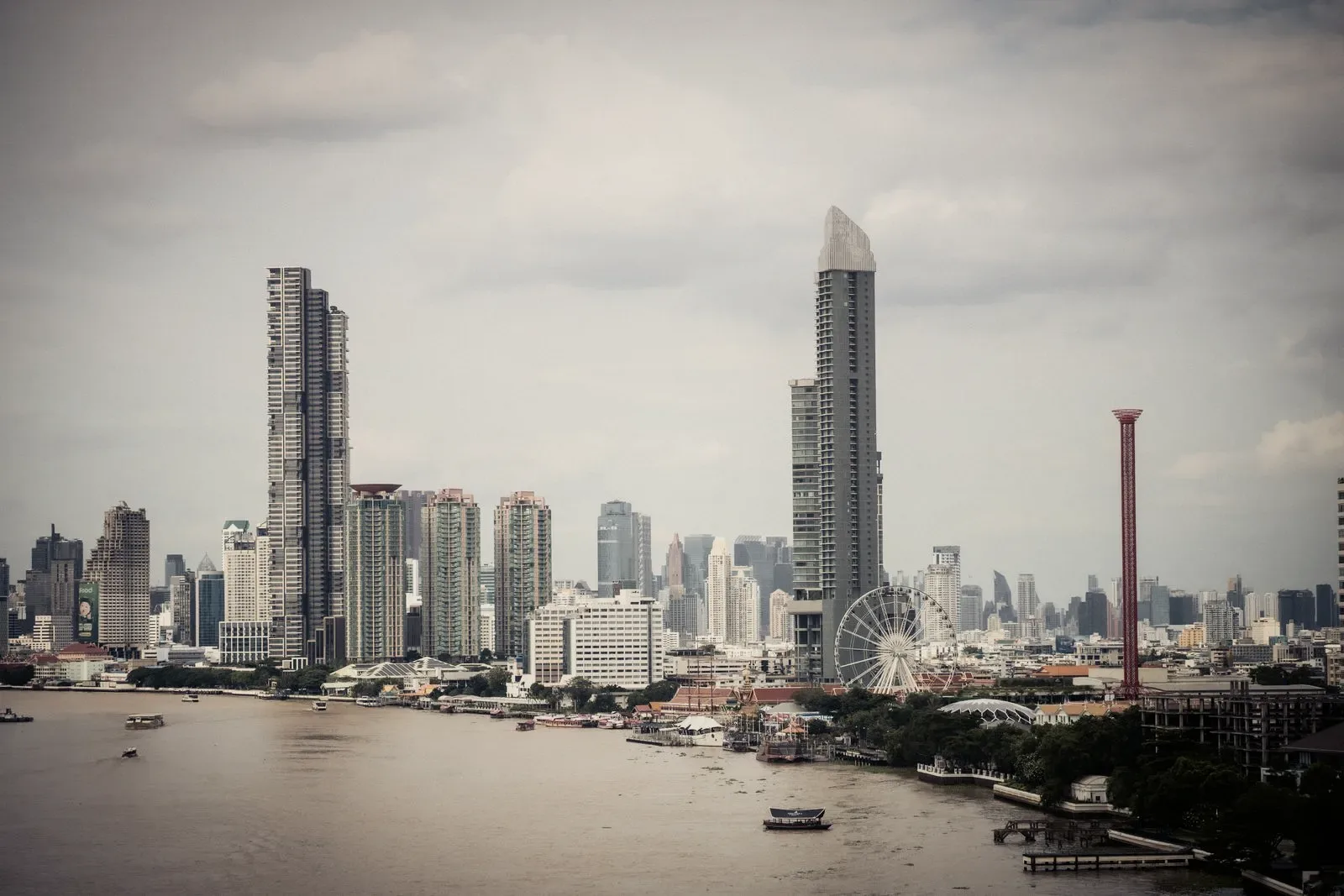 The Bangkok riverside at dusk, the district the clinic sits in.
