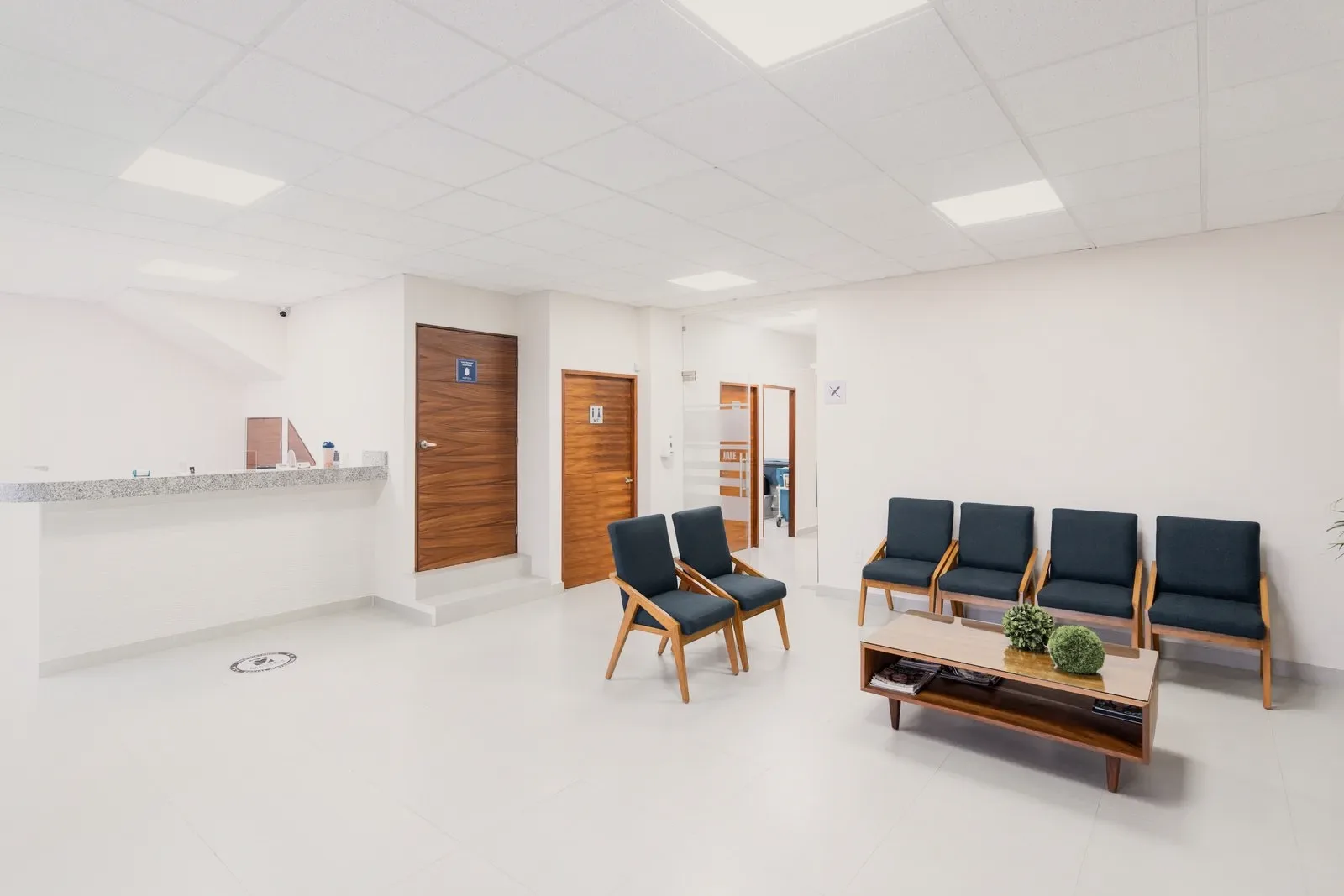 A clinic reception room furnished more like a living room than a waiting area.