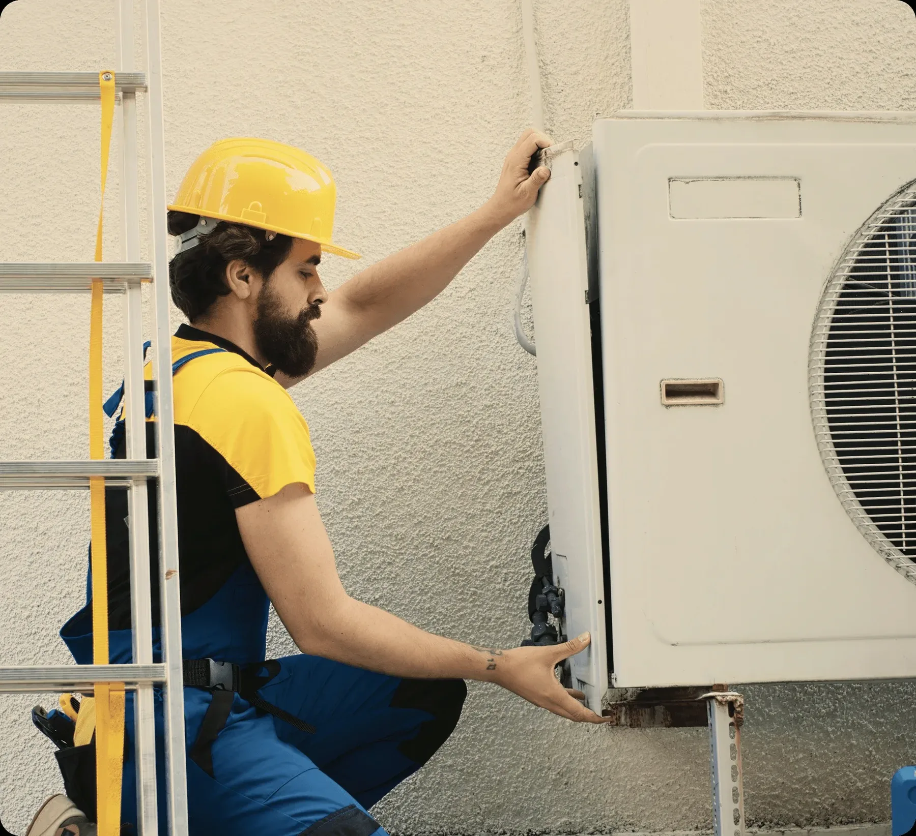 A technician on a ladder at an outdoor unit.