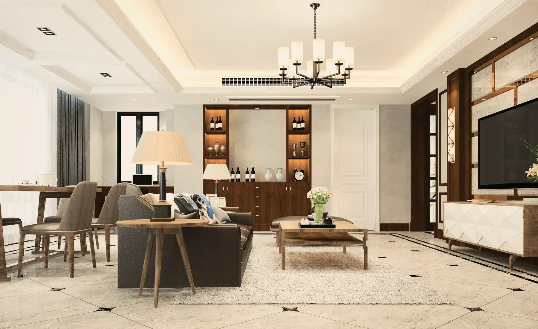 A living room with a chandelier, wooden cabinets and a grey sofa.