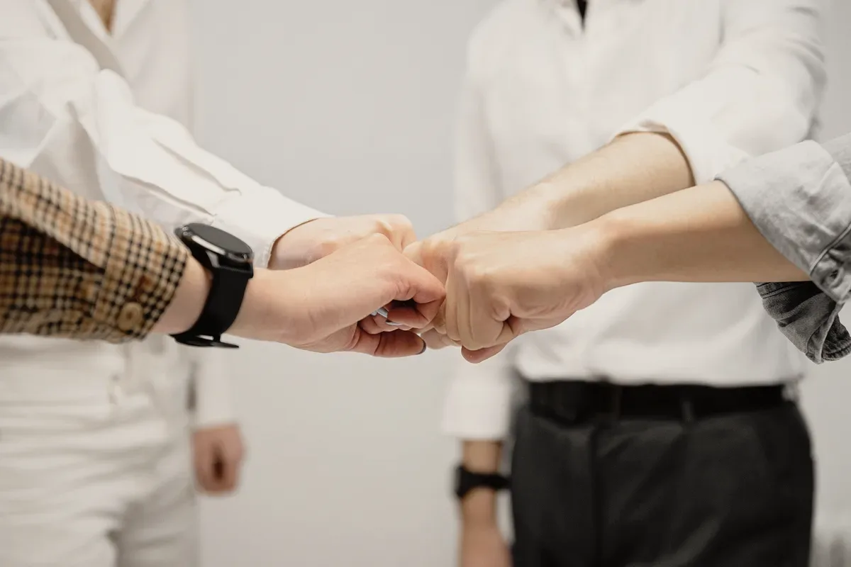 A handshake over a desk.