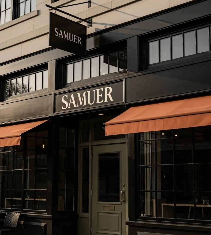 A shopfront with an orange awning.