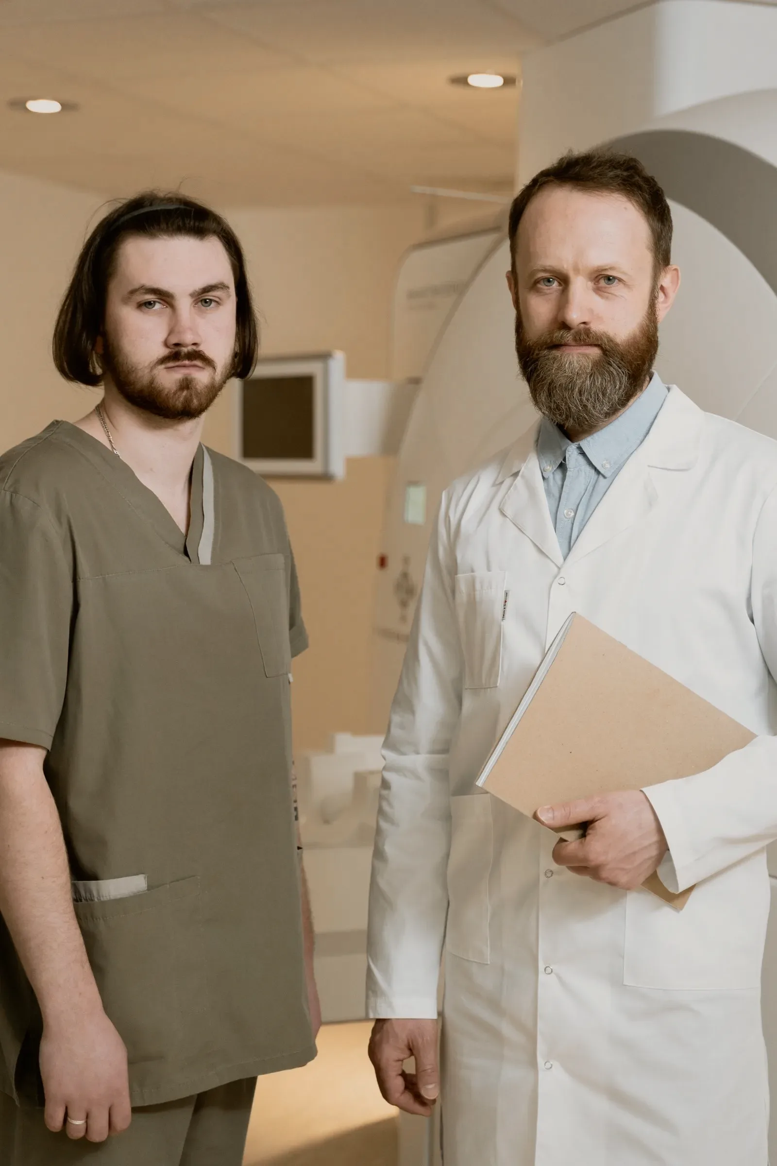 Two clinicians in a treatment room, talking rather than working.