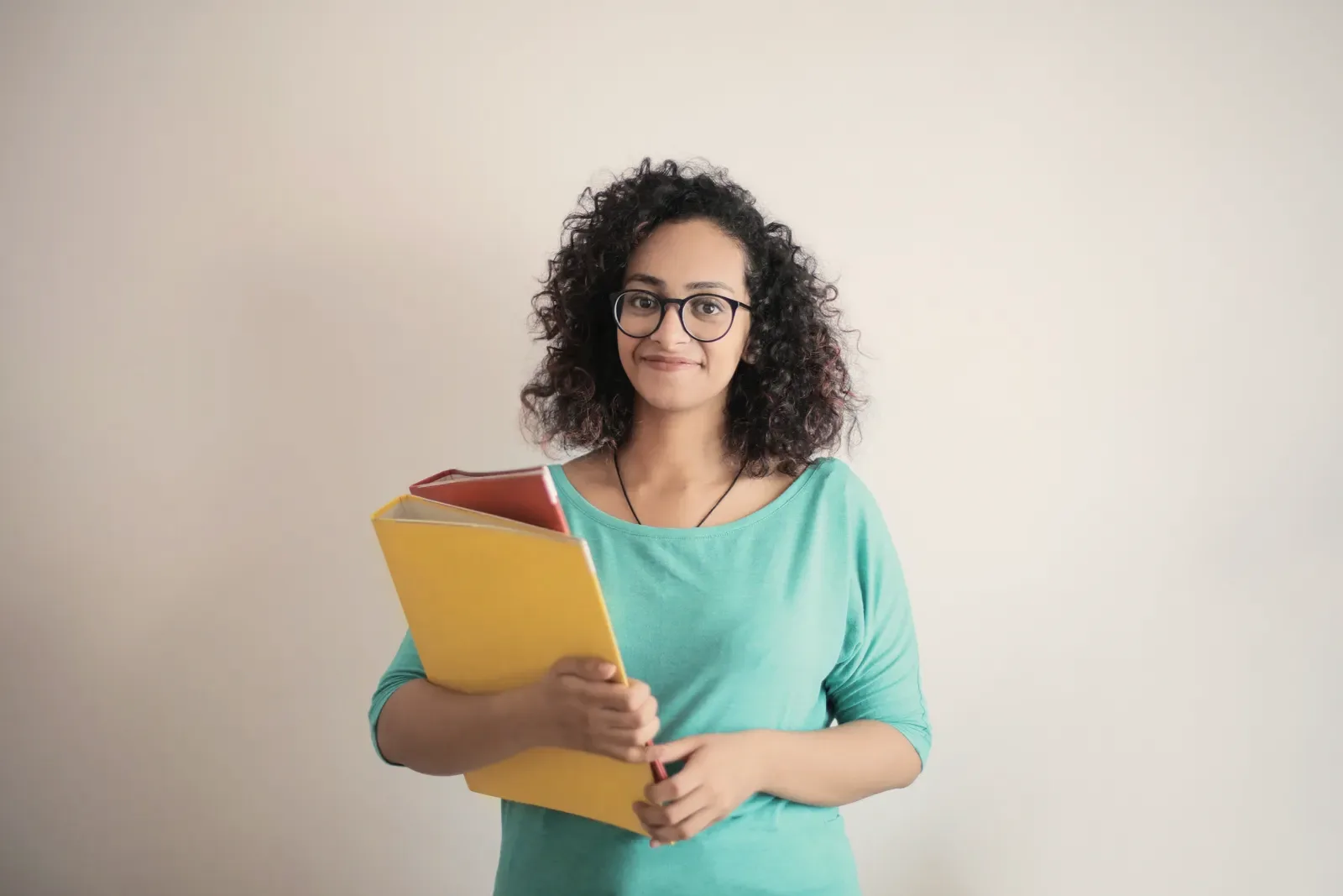 A stock portrait of a member of teaching staff against a plain background. Not a member of this school.