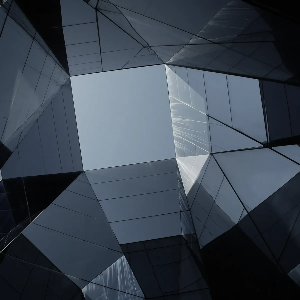 A glass building seen from below.