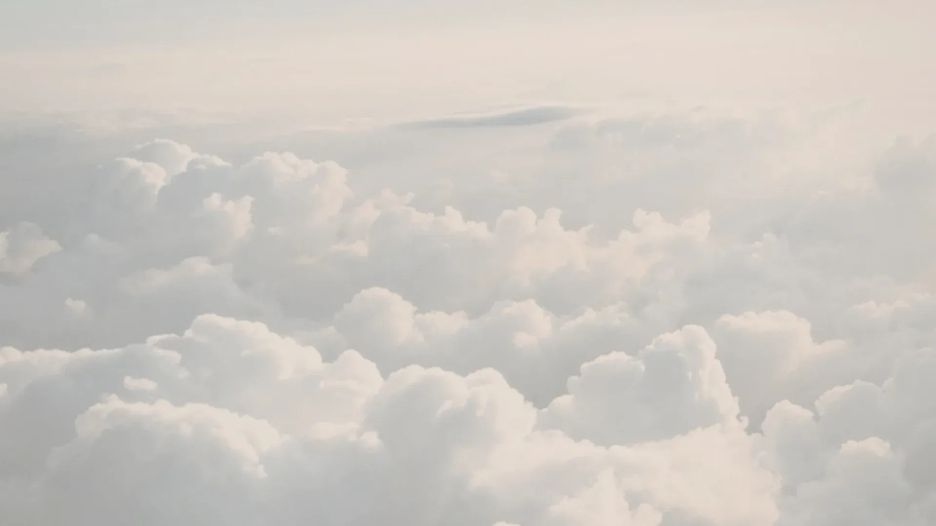 A bright sky over a sea of clouds.