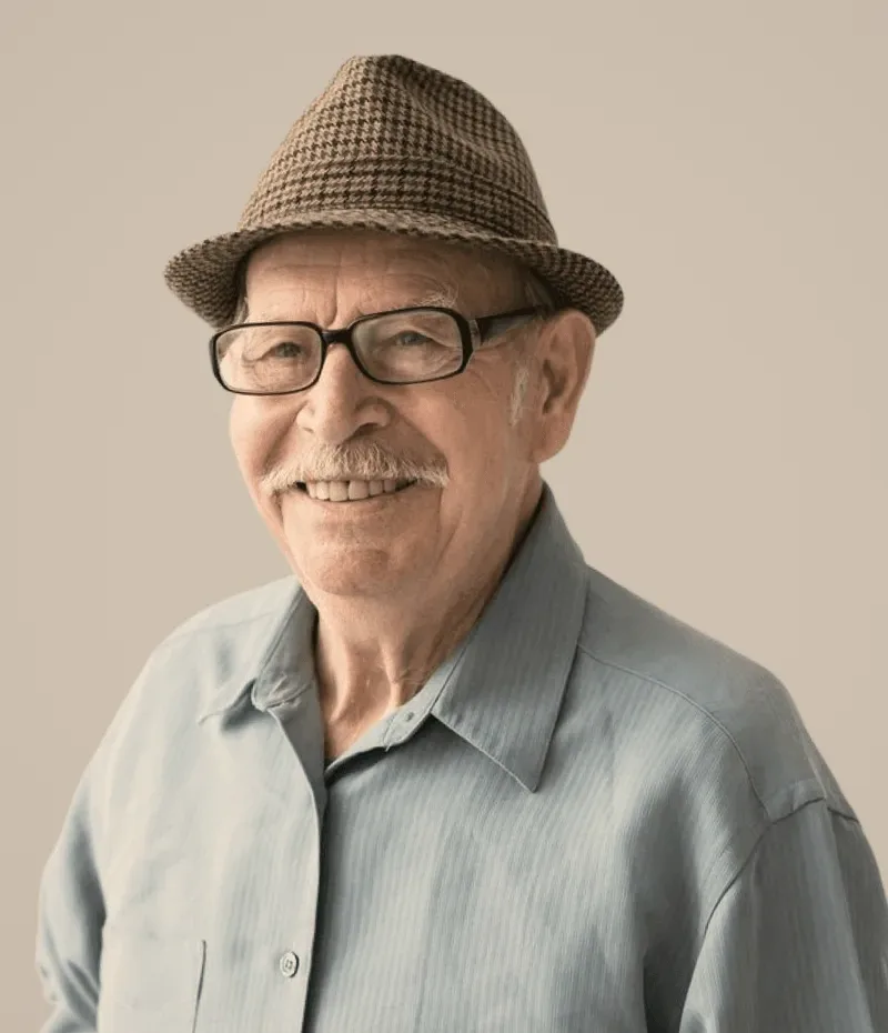A man in a hat and glasses.