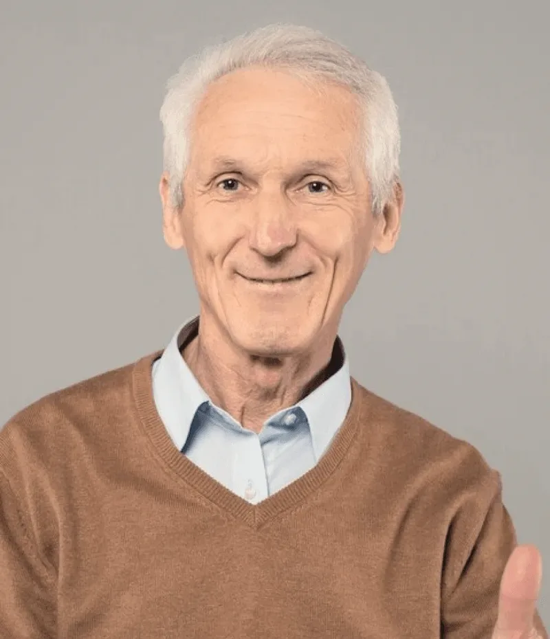 A man in a brown cardigan.