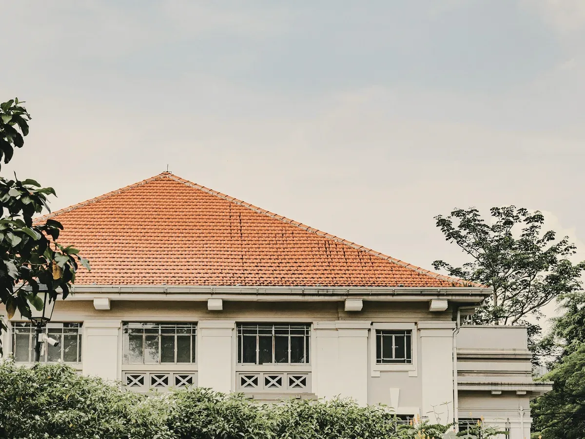 A house with an orange tiled roof.