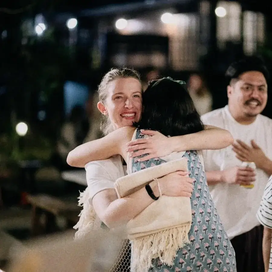 Guests hugging goodbye on the last night.