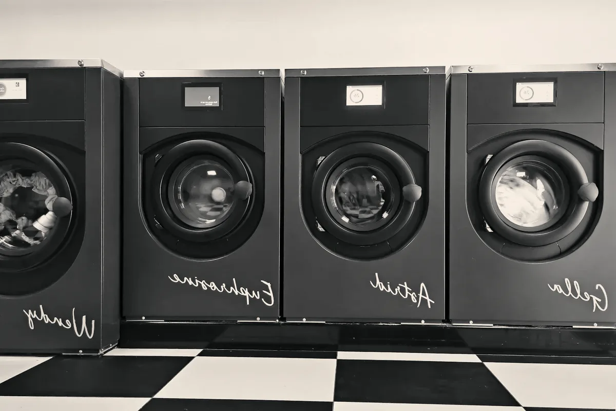 A row of black commercial washers.